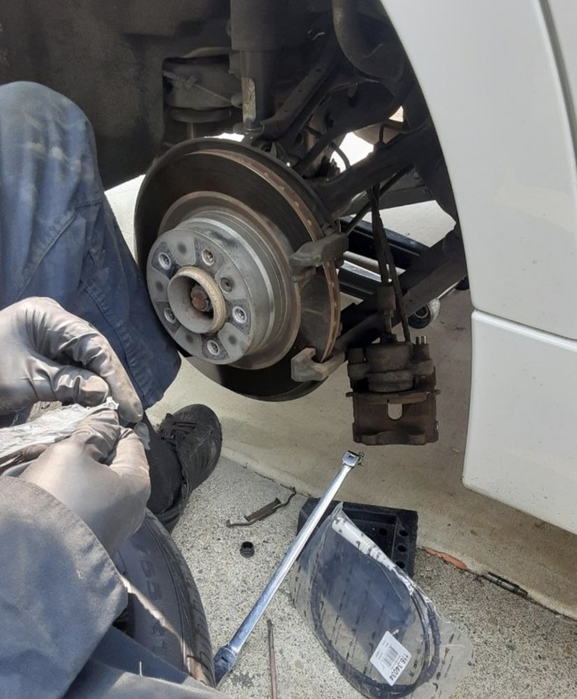 Battery test on a sedan in a Derby apartment complex lot